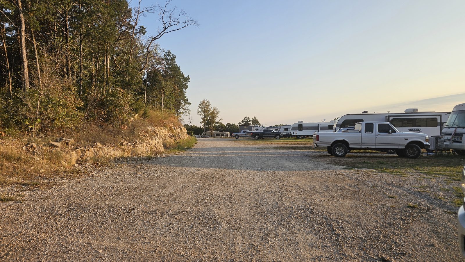 The park lane at sunrise, sites tucked among the Ozark oaks.
