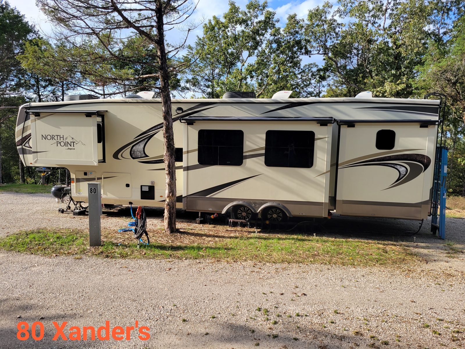 A North Point fifth-wheel set up on a full-hookup site at Area71.