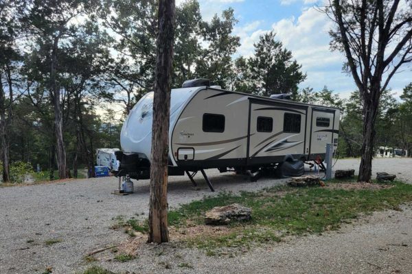 travel-trailer-in-a-camp-site travel-trailer-in-a-camp-site